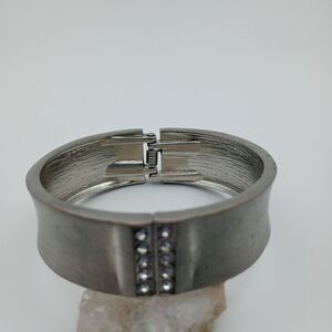 Silver tone hinge bracelet crystal encrusted accent. B533